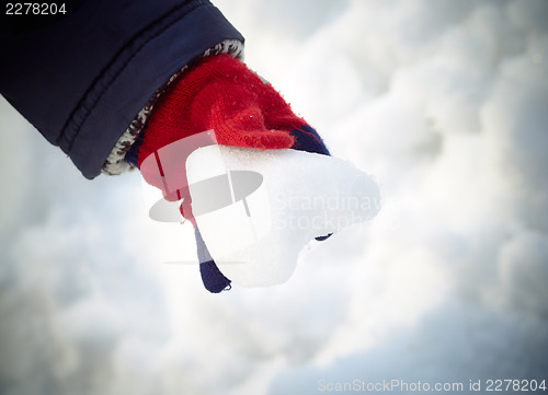 Image of Snow heart in child hand