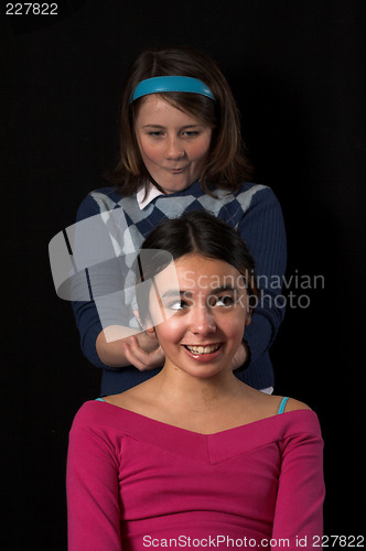 Image of teen posing over black backdrop