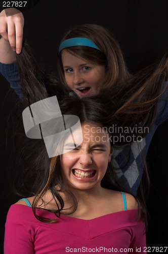 Image of teen posing over black backdrop