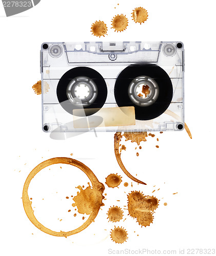 Image of Vintage audio tape with coffee stains. Isolated on white backgro