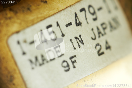 Image of Macro of a label sticker, dusted.