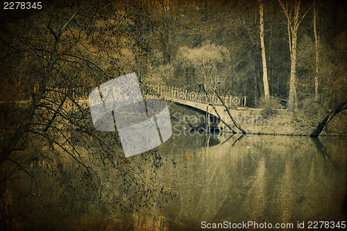 Image of Old bridge in park, vintage toned.