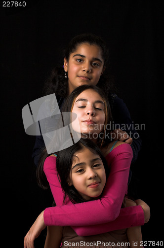 Image of teen posing over black backdrop