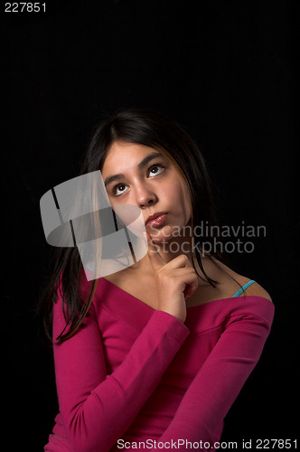 Image of teen posing over black backdrop