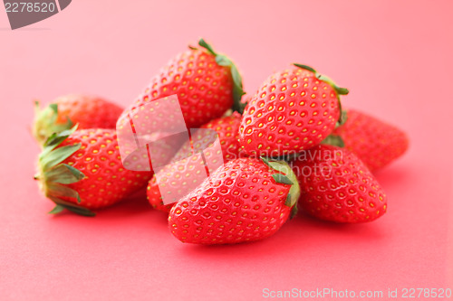 Image of Strawberries on pink background 