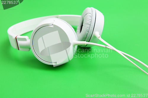Image of Headphone over green background