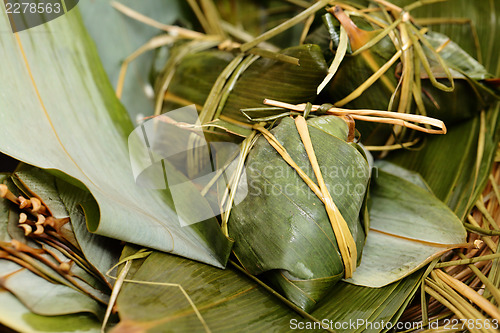 Image of Rice dumpling on bamboo leaves