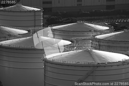 Image of Monochrome oil tank in cargo service terminal 