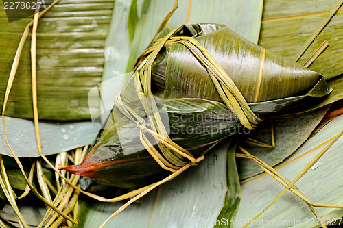 Image of Rice dumpling on bamboo leaves
