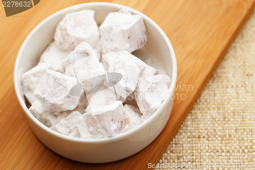 Image of Turkish candy on wooden plank 