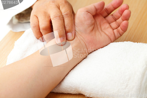 Image of Chinese doctor diagnose pulse of patient