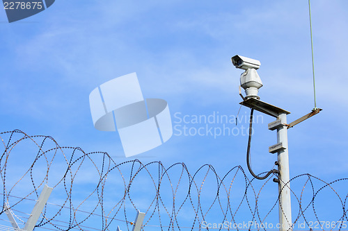 Image of CCTV on top of chain link 