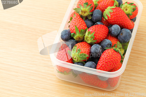 Image of Strawberry and blueberry mix in plastic container