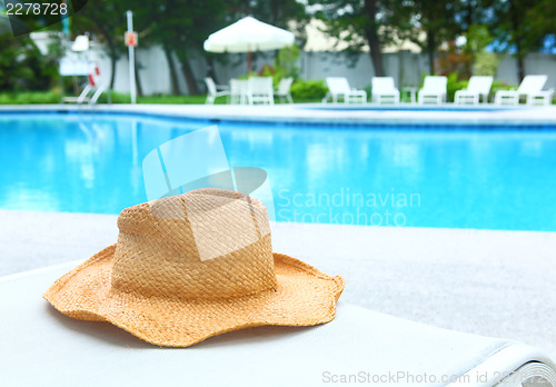 Image of Wicker hat with swimming pool