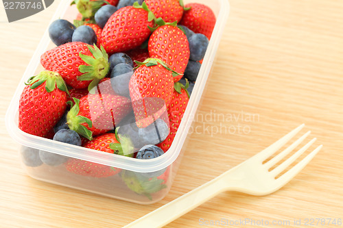 Image of Strawberry and blueberry mix in plastic container