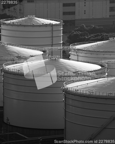 Image of Monochrome oil tank in cargo service terminal 