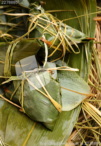 Image of Rice dumpling on bamboo leaves