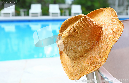 Image of Wicker hat with swimming pool