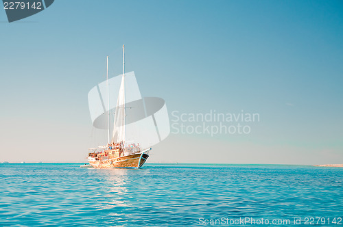 Image of Sailboat in blue sea