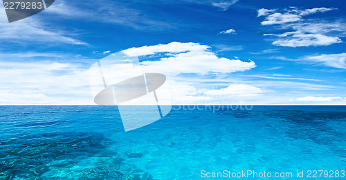 Image of Transparent ocean and cloudy sky