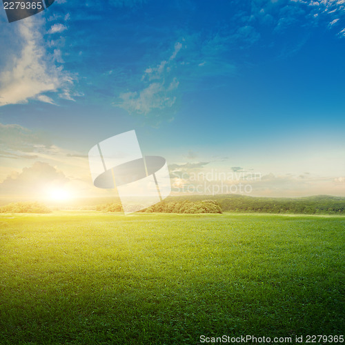 Image of Meadow and clouds sunrise