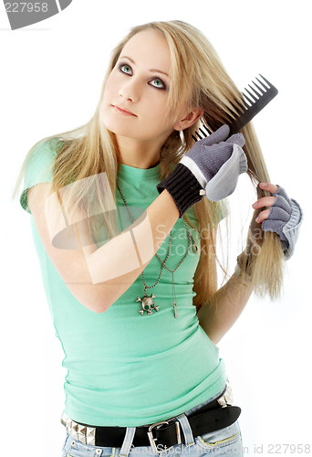 Image of hair combing teenager girl