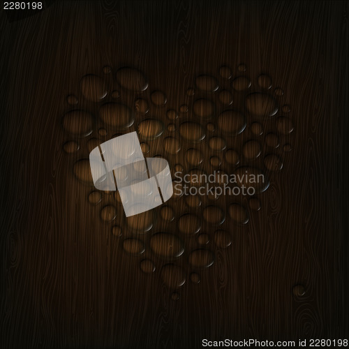 Image of Heart shaped water drops on a wooden texture. 