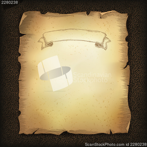 Image of Aged old scroll parchment with ribbon image on dark brown leathe