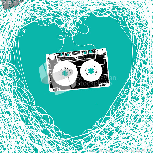 Image of Old stereo audiocassette with tangled heart shaped magnetic tape