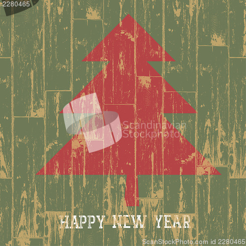 Image of New year tree symbol with greetings on wooden planks texture. Ve