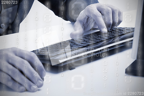 Image of Man Working at a Computer Keyboard