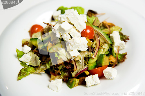 Image of Summer salad with toppings of feta cheese