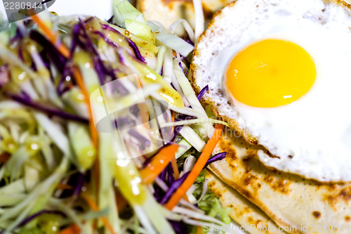 Image of Fried egg and coleslaw, rich breakfast