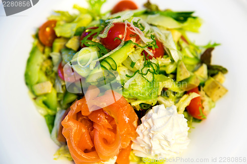 Image of Salmon with avocado, tomatoes and cream