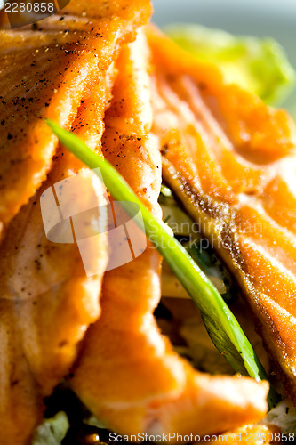 Image of Baked salmon with vegetables served in dinner