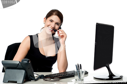 Image of Female executive assisting client over a call