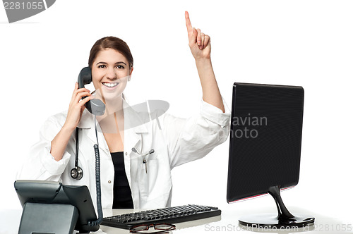 Image of Female physician answering phone call