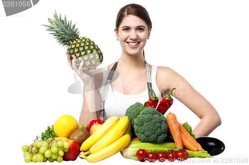 Image of Beautiful young woman with fruits and vegetables