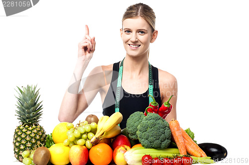 Image of Pretty slim girl with fruits and vegetables