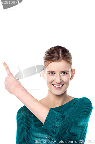 Image of Charming female model pointing away