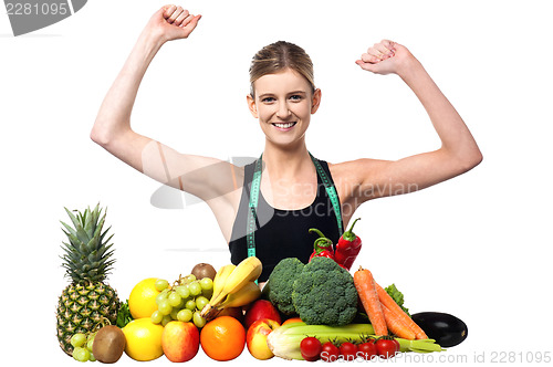 Image of Happy teenager with fruits and vegetables