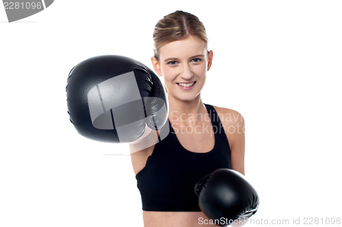Image of Fitness woman wearing boxing gloves