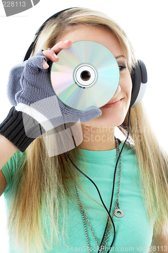 Image of urban teenage girl in headphones holding cd