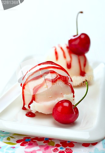 Image of fruit sorbet decorated with fresh red cherry