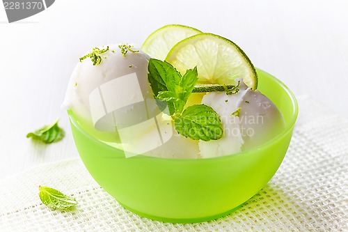 Image of lemon sorbet decorated with lime slices and mint