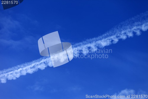 Image of Blue sky with contrail