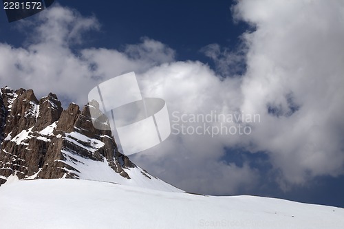 Image of Rock and snow pass in clouds