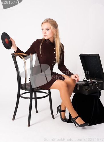 Image of Pretty blonde woman with gramophone