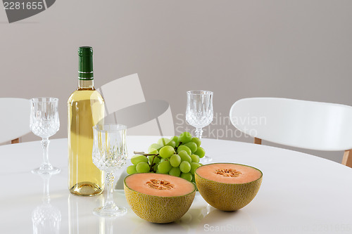 Image of White wine, melon and grapes