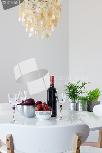 Image of Elegant table with red wine and fruits